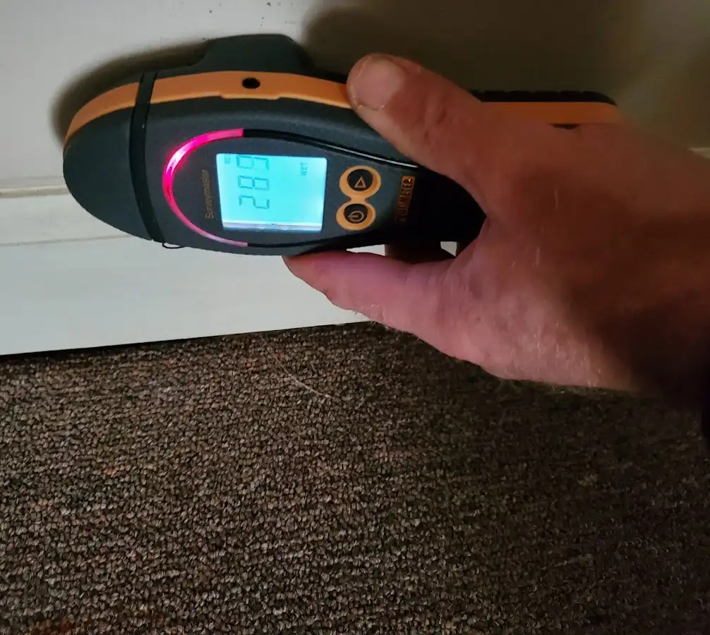Moisture detection at baseboard during Burst Pipe Cleanup in McSwain
